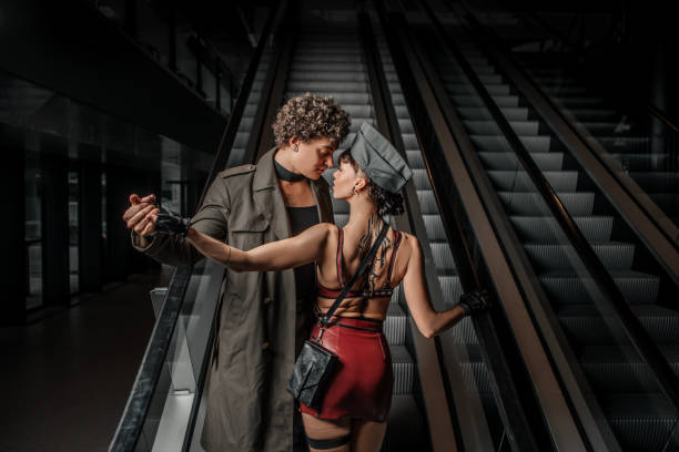 Beautiful diverse couple saying goodbye at a transport hub