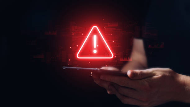 istock Caution concept. The person is holding a tablet with a sign. 1473761526