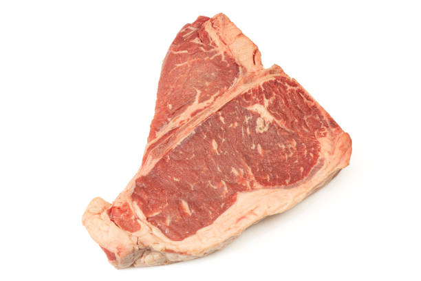 dallas steak with garnish at bamboo plate on isolated white background