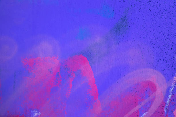 Pink, magenta, white painted plaster wall surface background with colorful drips, flows, streaks of paint and paint sprays