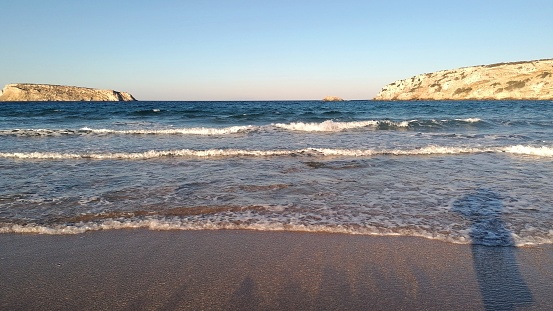 Walking along the beach, sea shore and listening to the calm waves of the sea.