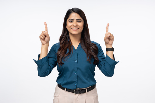 photo of cheerful positive woman pointing up for social media isolated white background