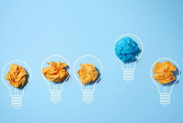 istock Crumpled paper sheets inside a drawn light bulb, concept of new creative idea, innovation 1473766363
