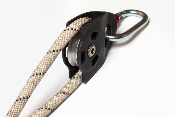 istock Roller block with carabiner and rope isolated on white background. Alpinism, high-altitude work. Equipment. 1473769279