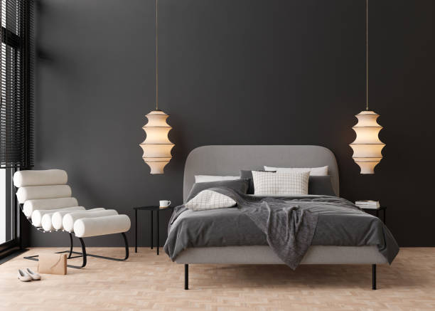 istock Interior mock up, loft style. Empty black wall in modern bedroom. Copy space for your artwork, picture, poster. Contemporary style interior design. Apartment or hotel room with bed. 3D render. 1473770405