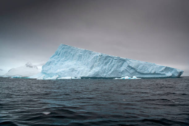 istock atmospheric landscape at Curtis Bay with icebergs floating in Antarctica 1473771627
