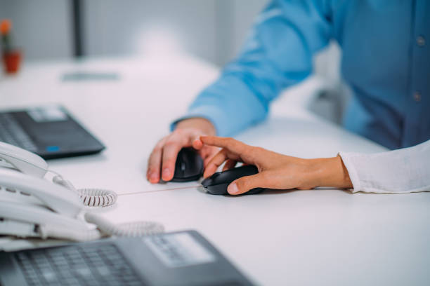 istock Office Romance. Colleagues Flirting at a Workplace 1473775668