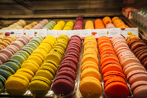 Colorful macaroons in the showcase of the pastry shop