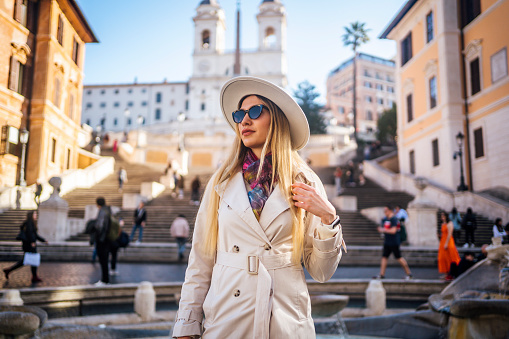 Young woman tourist in front of the famous Spanish steps in Rome, Italy