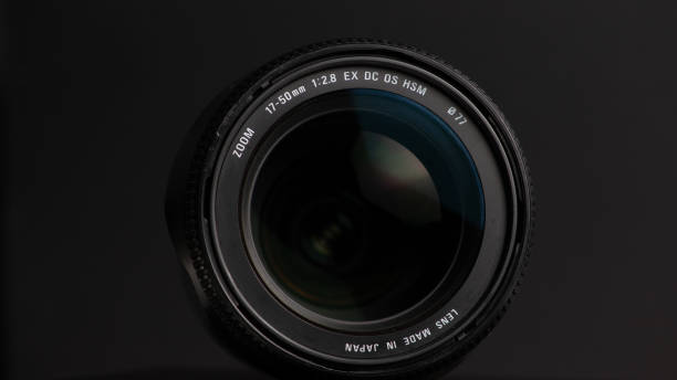 istock Camera lens on a black background. Close-up of a camera lens. 1473780924