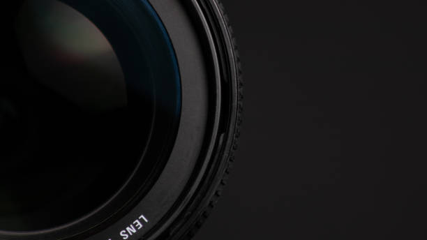 istock Camera lens on a black background. Close-up of a camera lens. Focus 1473780925