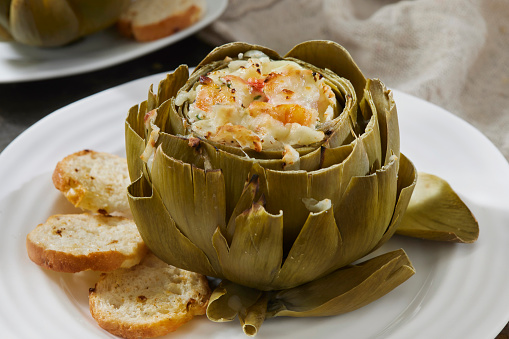 Hot, Creamy Baked Crab and Shrimp Stuffed Artichokes with Crostini's