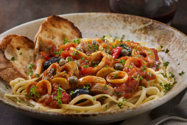 istock Saucy Italian Style Calamari with Tomatoes 1473784116
