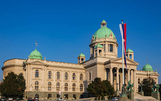 Parliament of Serbia in Belgrade, building of the National Assembly of the Republic of Serbia with a national flag