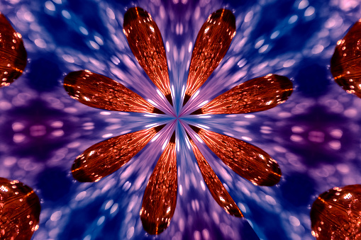 Colorful kaleidograph in red, white, and blues generated from a photograph