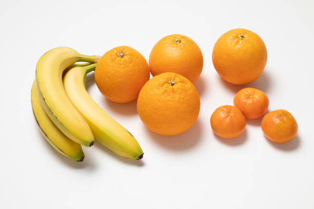 Oranges, Tangerines and a banana on white