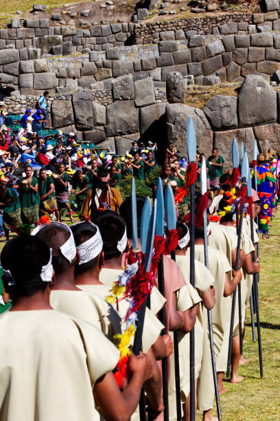 Inti Raymi Festival Cusco Peru South America Men In Costume Men In Traditional Costume Inti Raymi Festivel Cusco Peru South America Soldiers With Spears And Men Carrying Pots And Grain inti raymi stock pictures, royalty-free photos & images