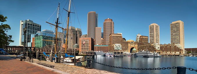 Boston, Massachusetts, USA  July 19, 2022:  Downtown city panoramic skyline view of the office buildings and apartments from the harbour wharf in Fan Pier Park by the North End of downtown Boston Massachusetts United States