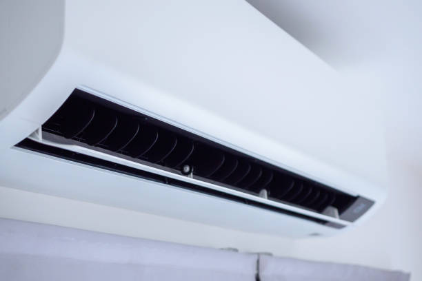 istock Air conditioner on white wall room interior background 1473798303