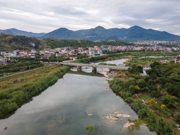 istock Town and mountains along the river 1473799448
