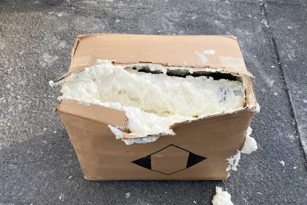 Damaged container with polyurethane foam, damaged box with polyurethane foam
