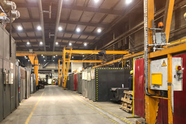 istock Overhead cranes inside industrial building. Bridge cranes inside hangar 1473799958