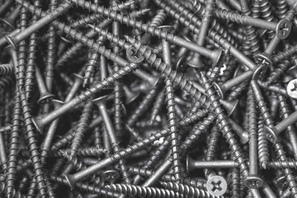 istock Black wood screws, many screws, close-up 1473800019