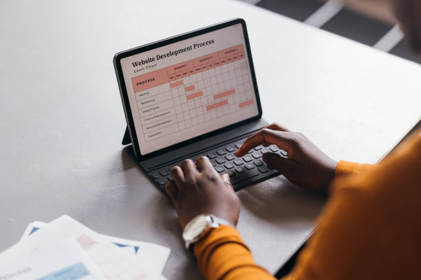 istock An Unrecognizable Businessman Working On His Tablet 1473801273