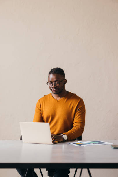 istock A Happy Businessman With Glasses Working On His Computer 1473801277