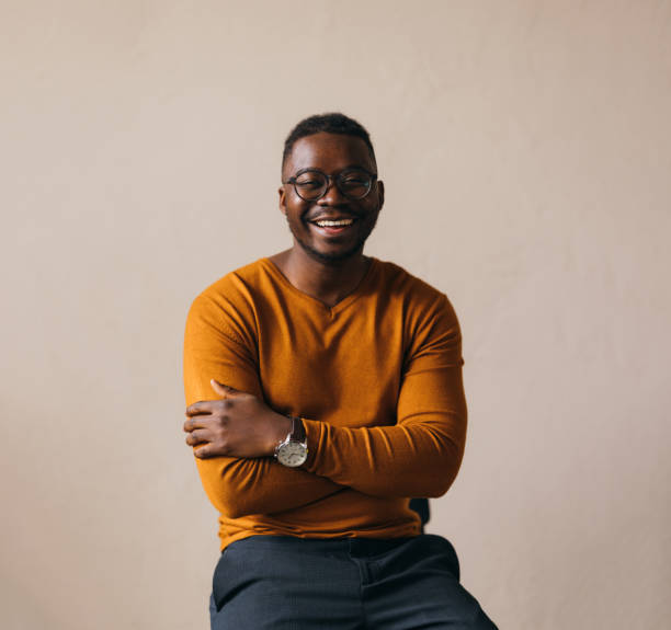 A Happy Businessman With Glasses Looking At Camera