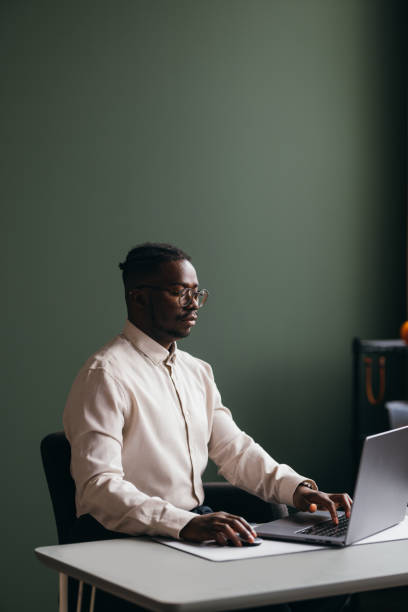 istock A Serious  Businessman With Glasses Working On His Computer In The Office 1473801298