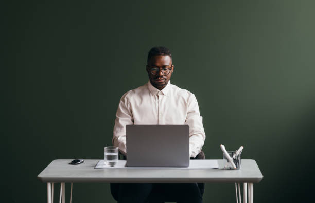 istock A Serious Businessman With Glasses Working On His Computer 1473801305