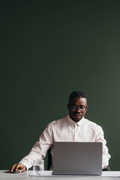 istock A Serious Businessman With Glasses Working On His Computer 1473801312