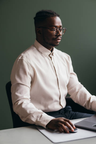 istock A Serious  Businessman With Glasses Working On His Computer In The Office 1473801340
