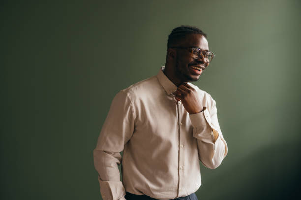 istock A Happy Businessman With Glasses Looking Away While Laughing 1473801343