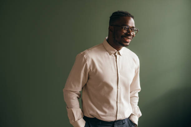 istock A Happy Businessman With Hands In His Pockets Looking Away 1473801351