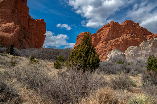 Massive, tall red sandstone rock formations in the Garden of the Gods of Colorado Springs, Colorado in western USA of North America.