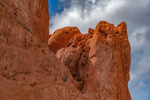 Tops of Massive, tall red sandstone rock formations in the Garden of the Gods of Colorado Springs, Colorado in western USA of North America.