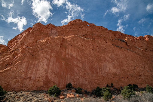 Massive, tall red and white sandstone rock formations and \