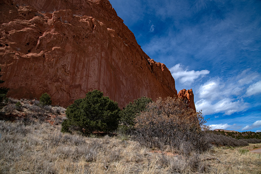 Massive, tall red sandstone rock formations in the Garden of the Gods of Colorado Springs, Colorado in western USA of North America.