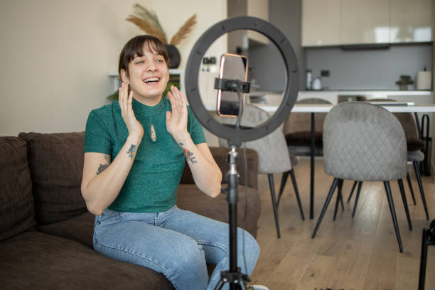 istock Young woman is recording a vlog 1473802738