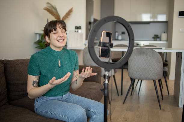 istock Young woman is recording a vlog 1473802741