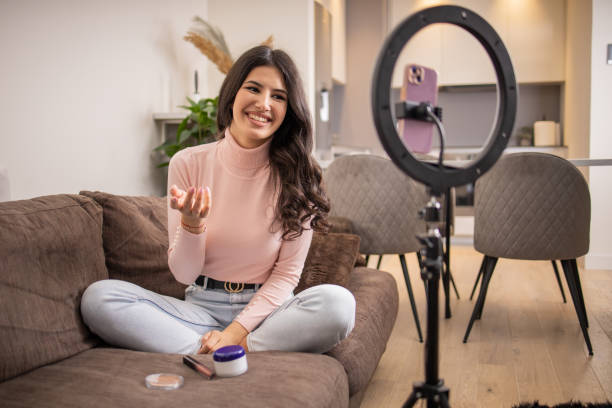 istock Smiling influencer records her podcast 1473802754