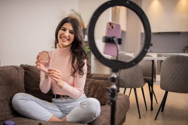 istock Smiling influencer records her podcast 1473802759
