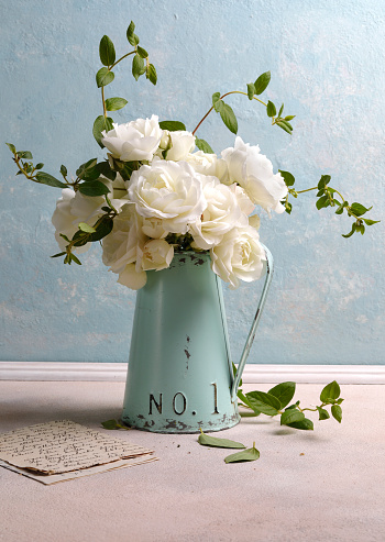 Vintage white bouquet  in a rustic metal jar