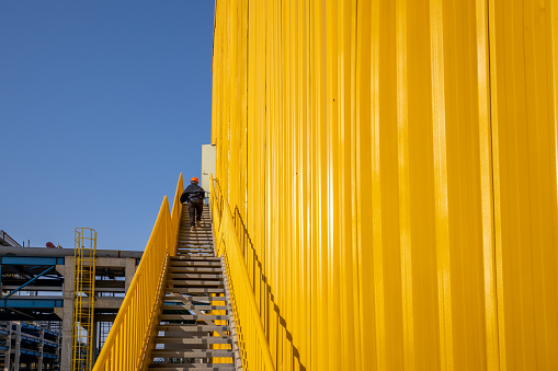 Partial close-up of the yellow iron sheet room of the factory