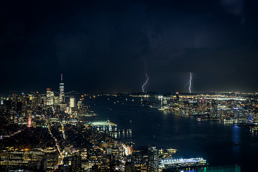 Aerial view of storm and lightning above the skyline of New York City and Jersey City