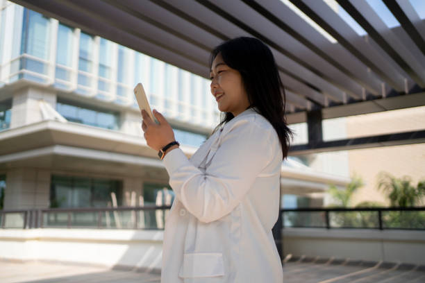 istock Asian business woman working in modern business environment 1473809721