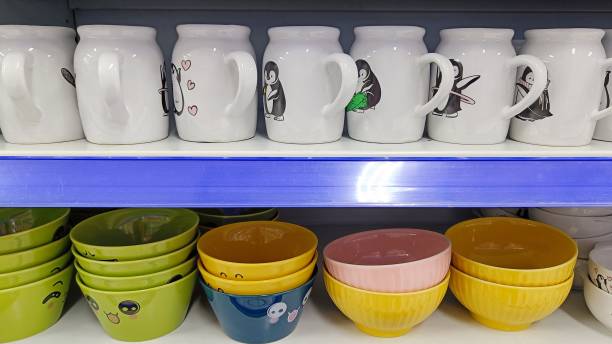istock white glasses with cute patterns and colorful bowls on a glassware rack 1473816719