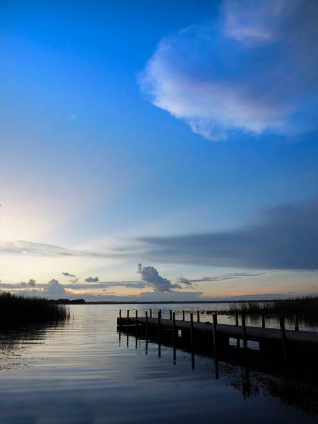 istock The Sun Rises on a Beautiful Florida Lake 1473819913